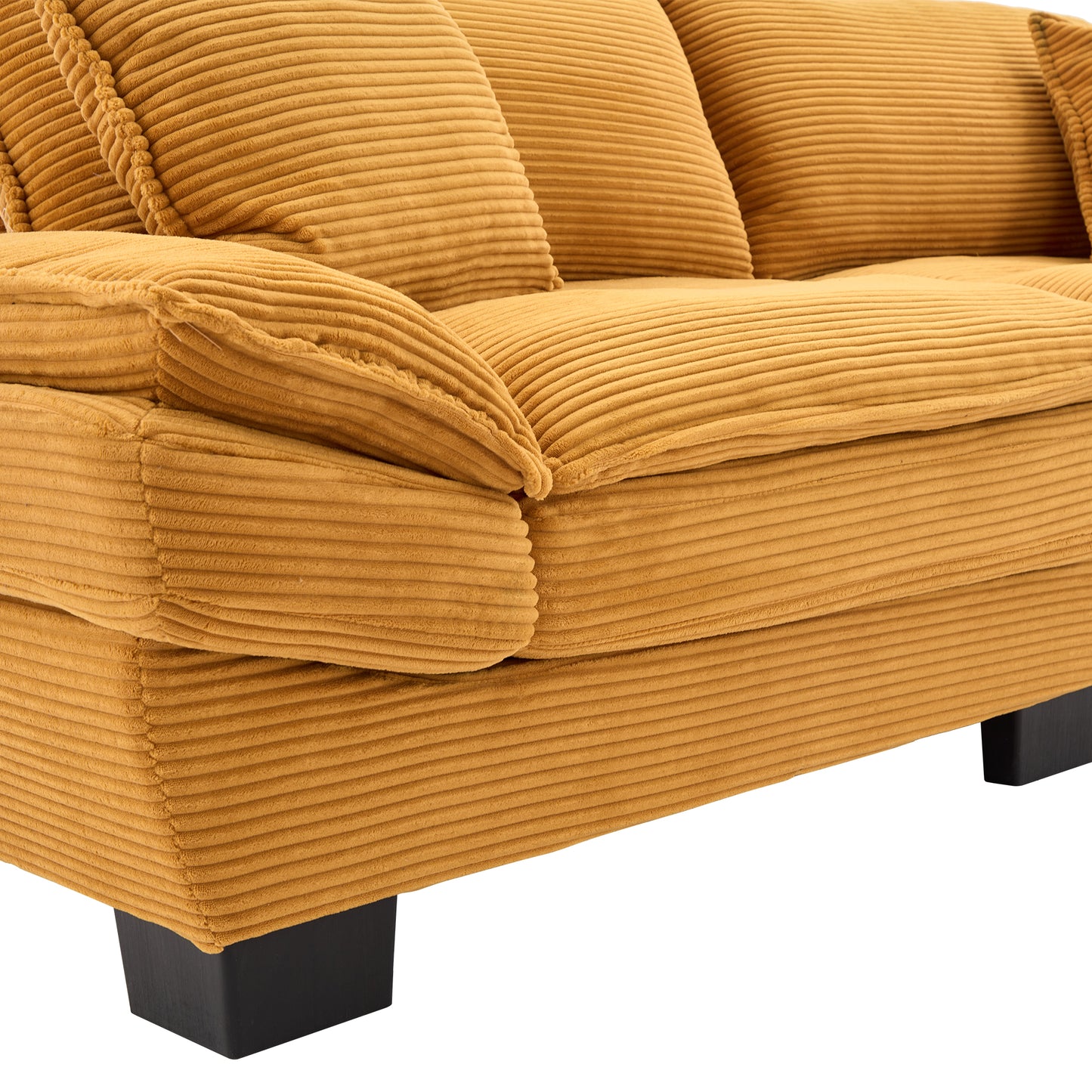 Mustard corduroy sofa with plush pillows offering a cozy seating experience
