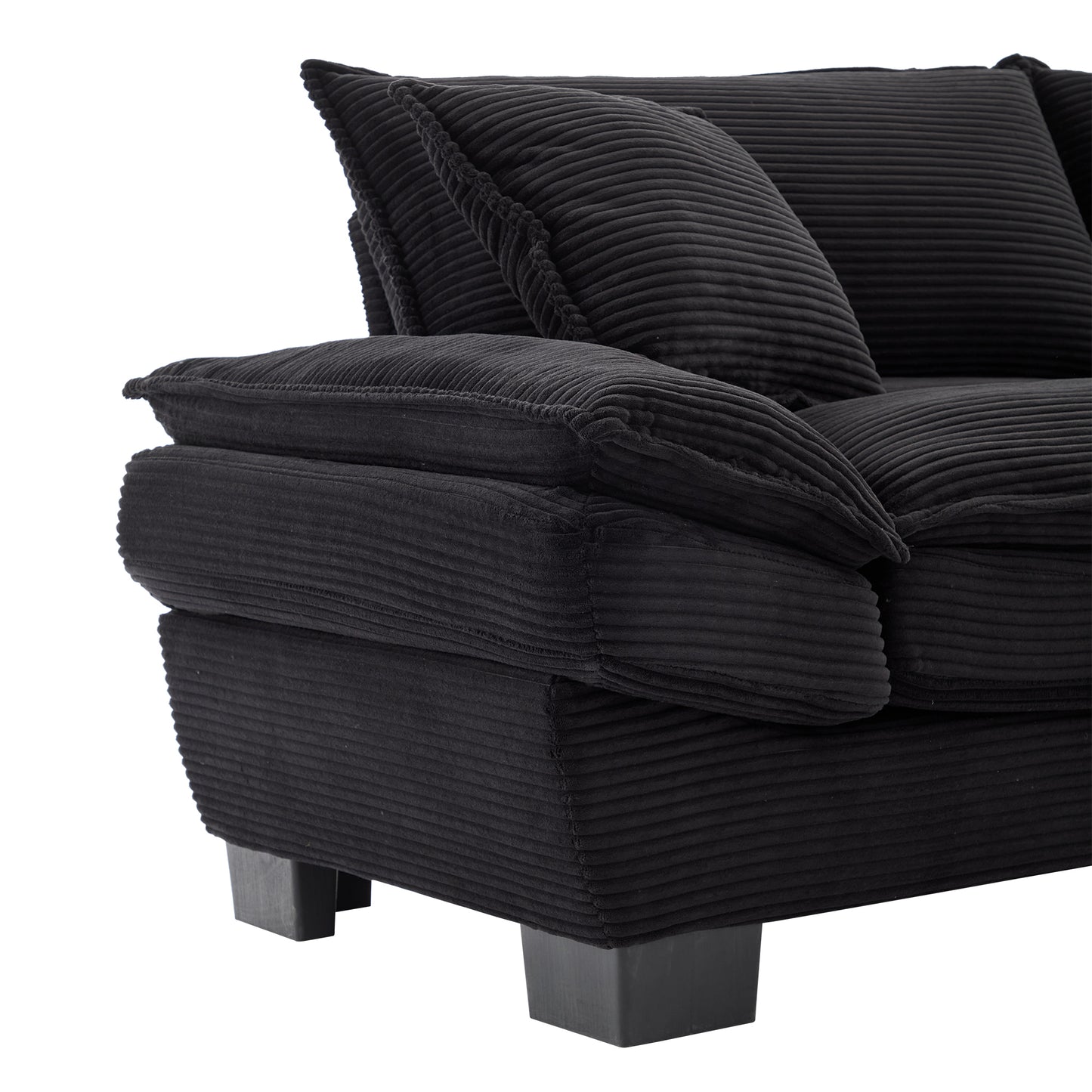 Black corduroy sofa with plush cushions featuring textured fabric and modern square legs