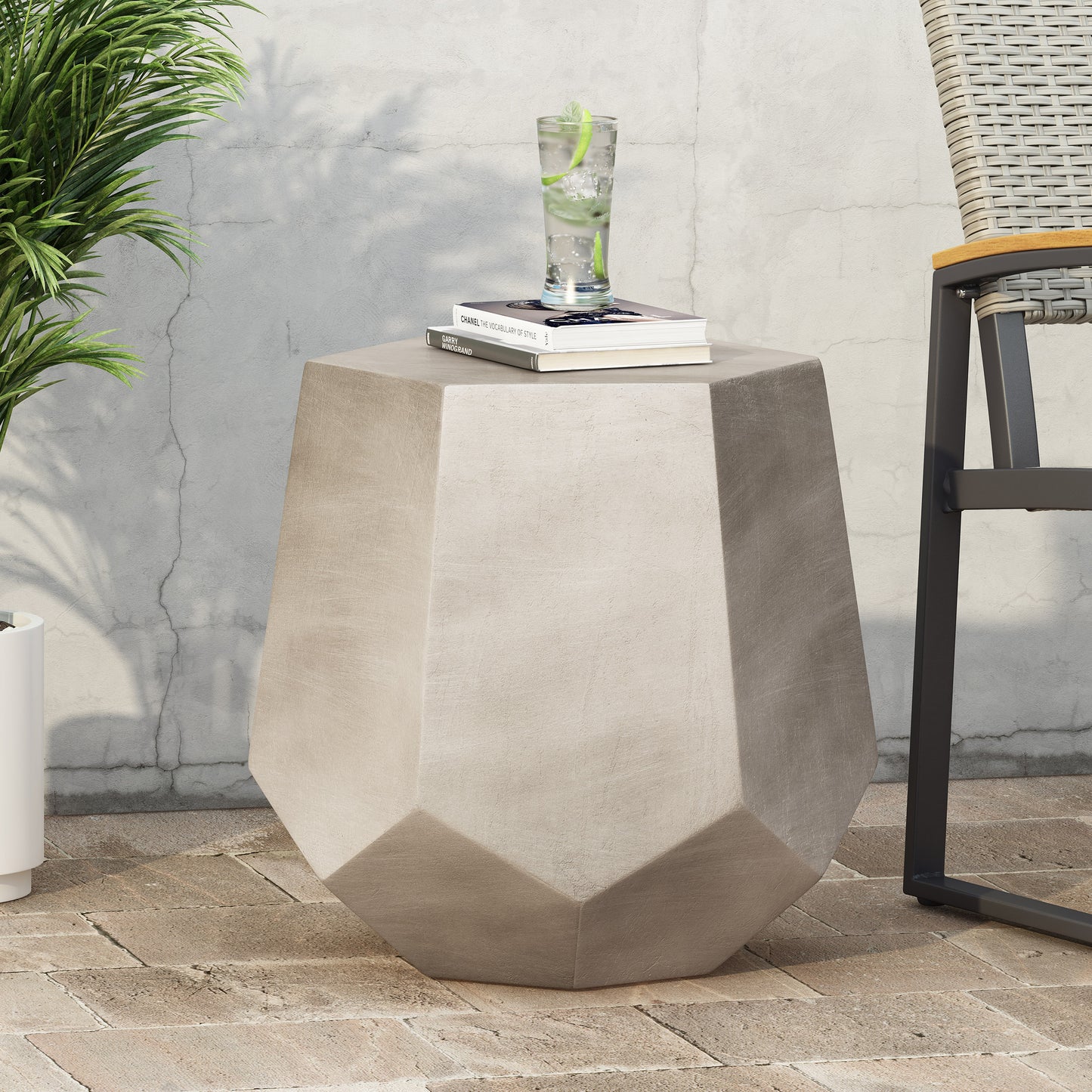 Geometric concrete garden accent table with textured stone finish ideal for patio settings