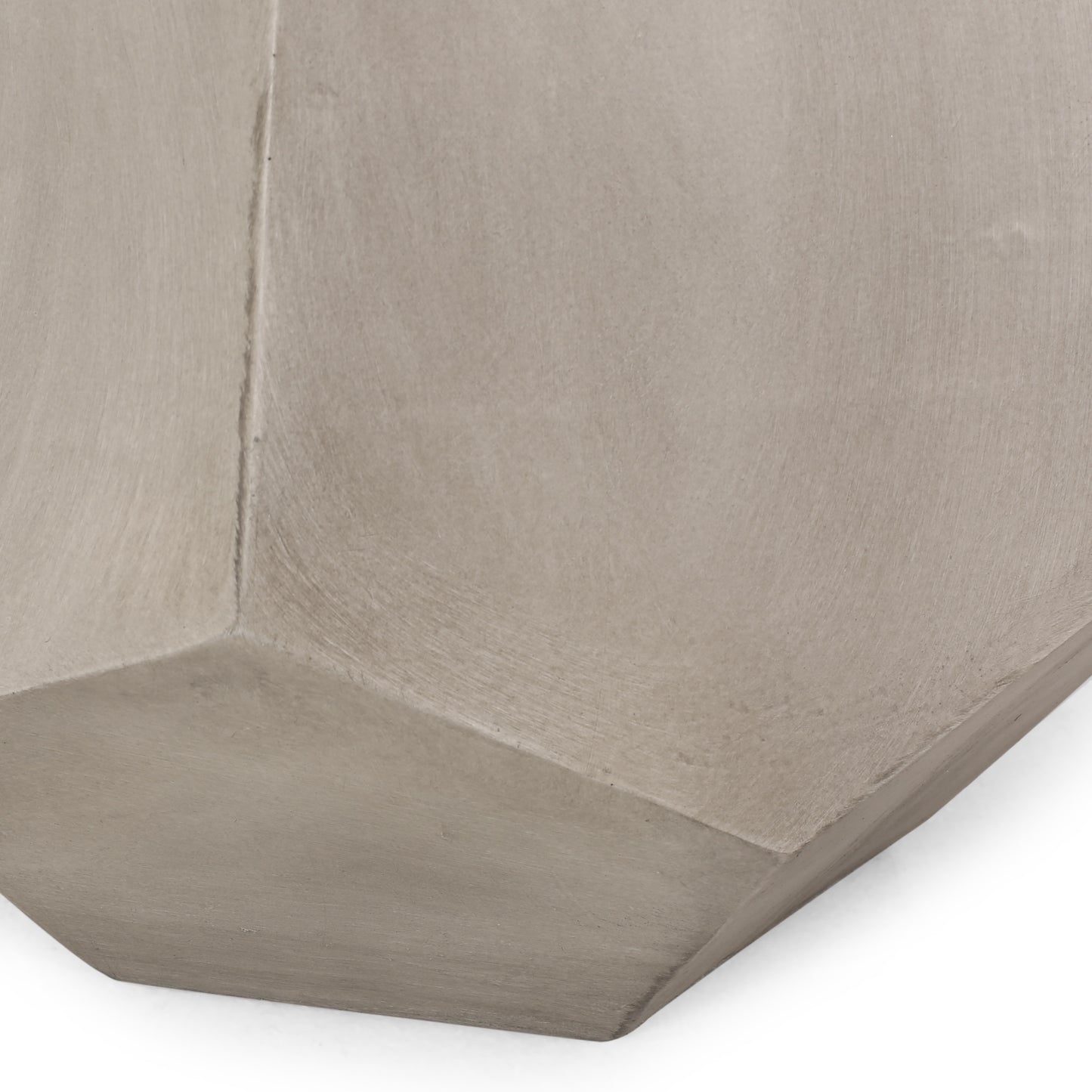 Closeup of textured concrete planter with geometric angles beige finish