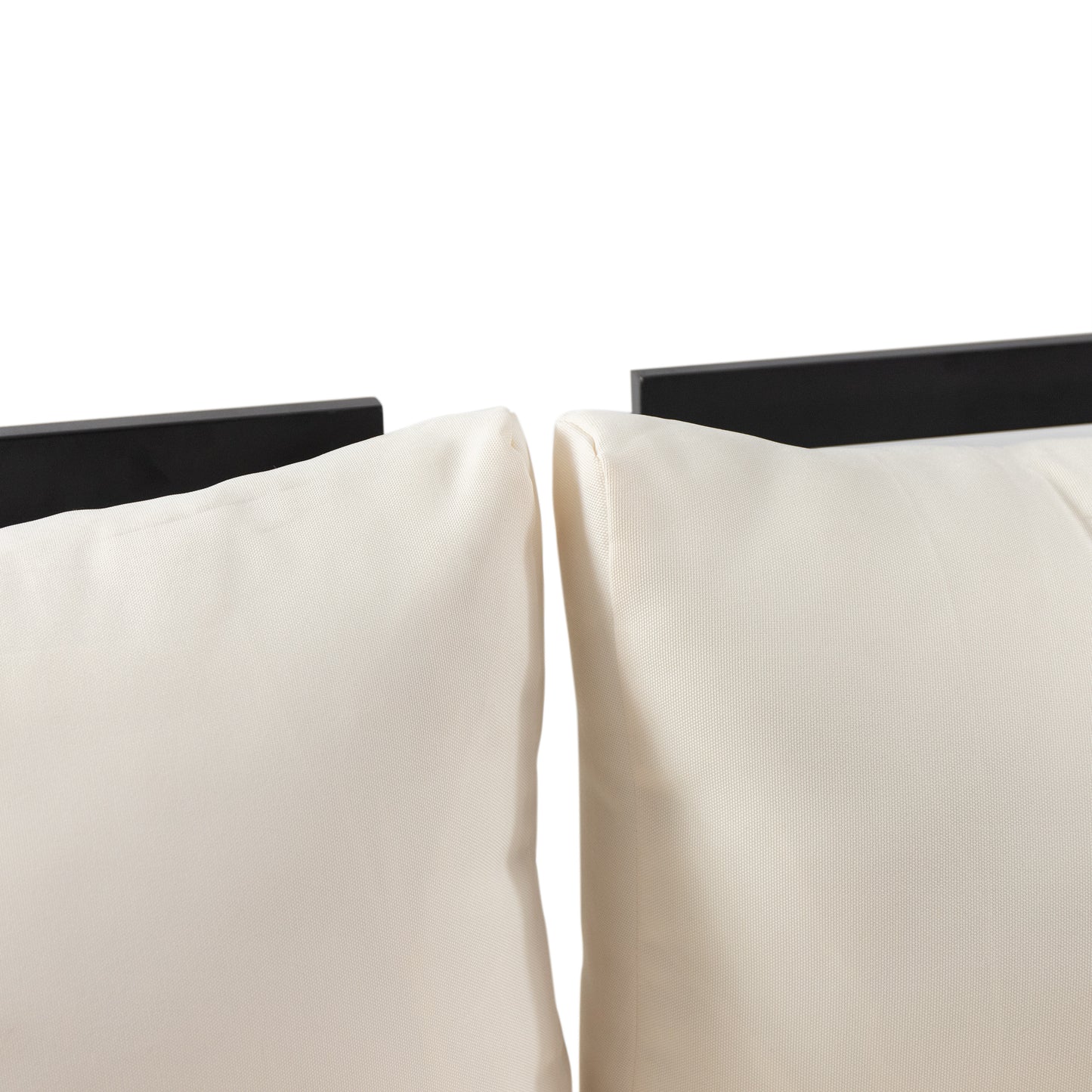 Closeup of two beige outdoor patio cushions with textured fabric and black framing