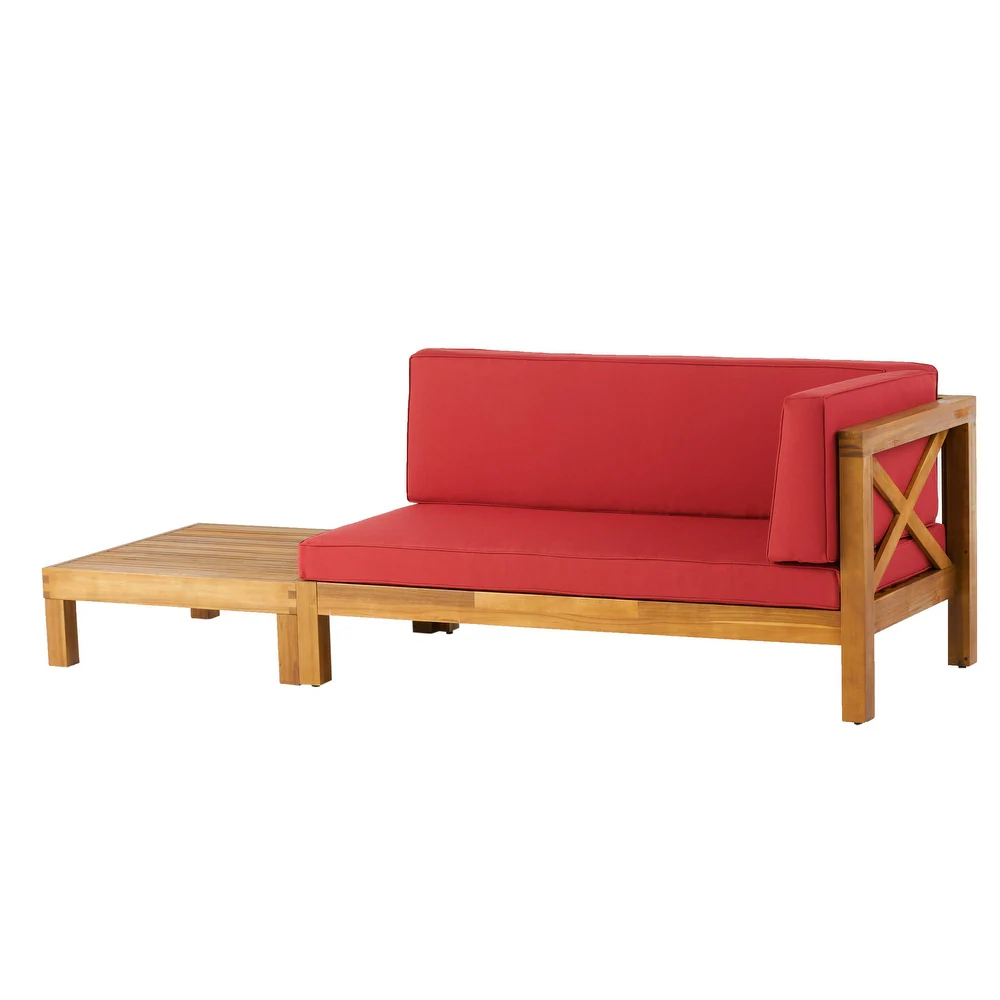 Outdoor sofa with red cushions and attached wooden side table