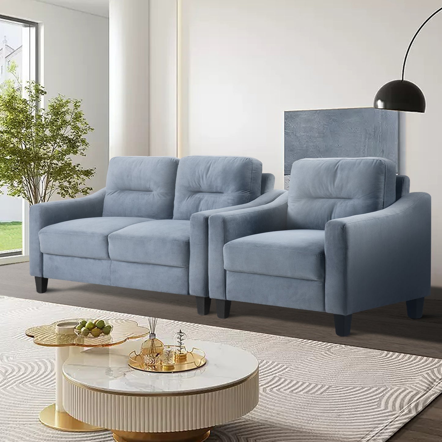 Light blue upholstered sofa and armchair set in a modern living room setting
