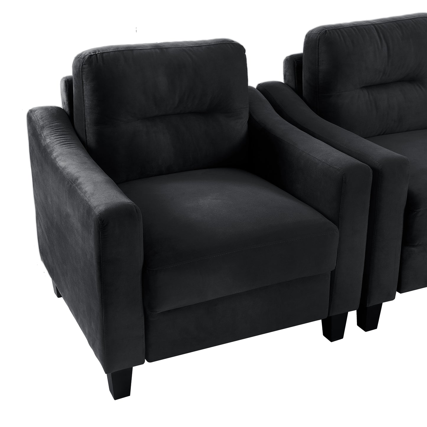 Plush black velvet armchair with tufted back and square armrests perfect for modern living rooms