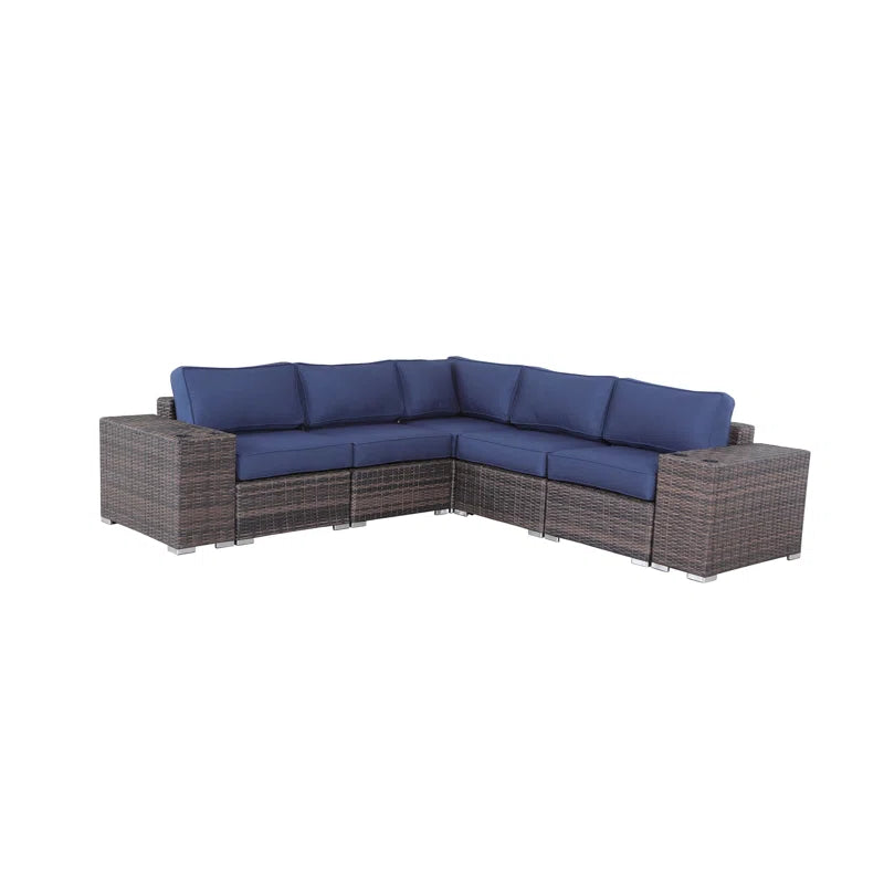 Sectional outdoor sofa with dark brown wicker and navy cushions