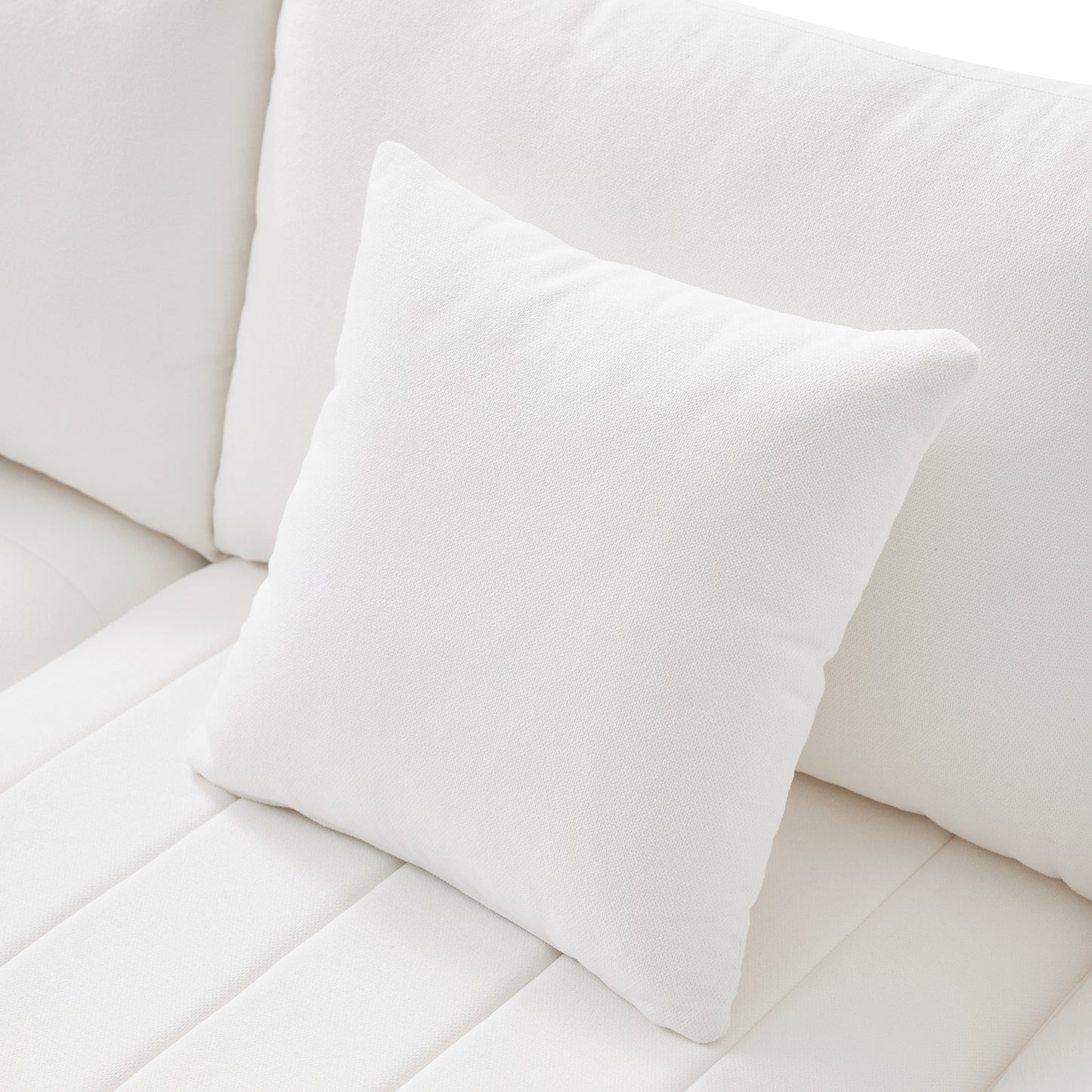 Plush white linen throw pillow perfect for adding comfort to any modern living room