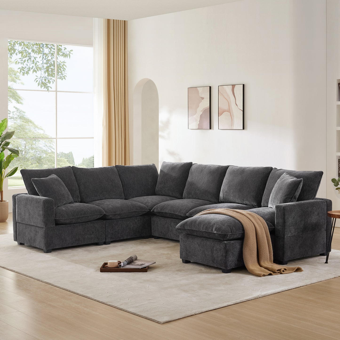 Plush charcoal gray sectional sofa with deep cushions ideal for modern living rooms