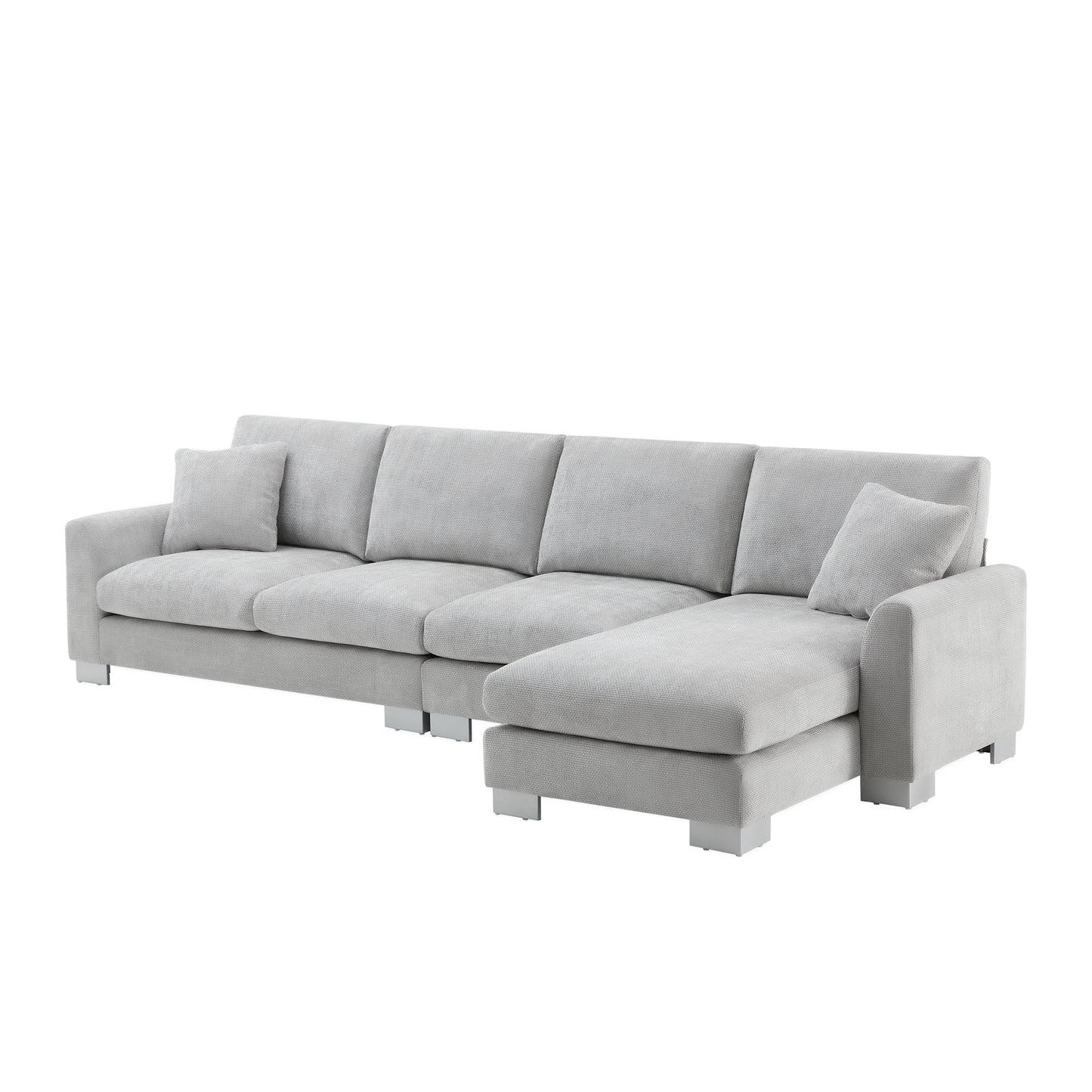 Light gray fabric sectional sofa with chrome legs and accent pillow