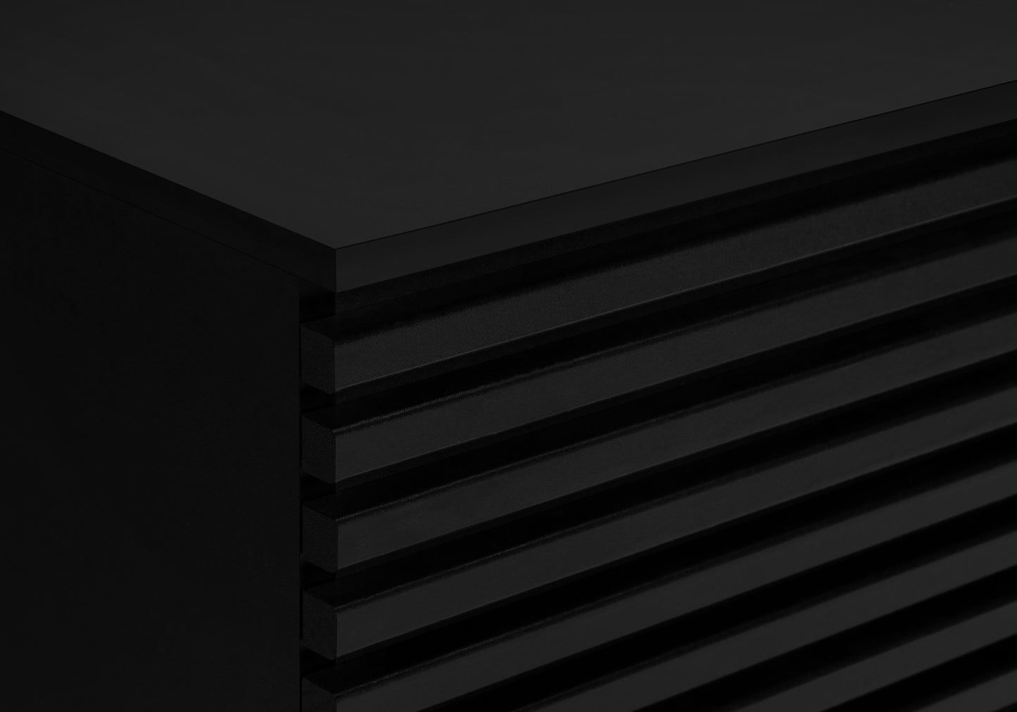 Matte black accent cabinet with ribbed door detail