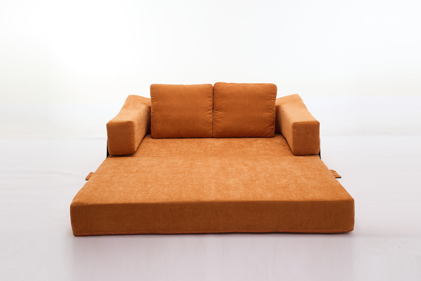 Orange fabric sofa bed with plush cushions and extended chaise lounge for comfortable seating and sleeping