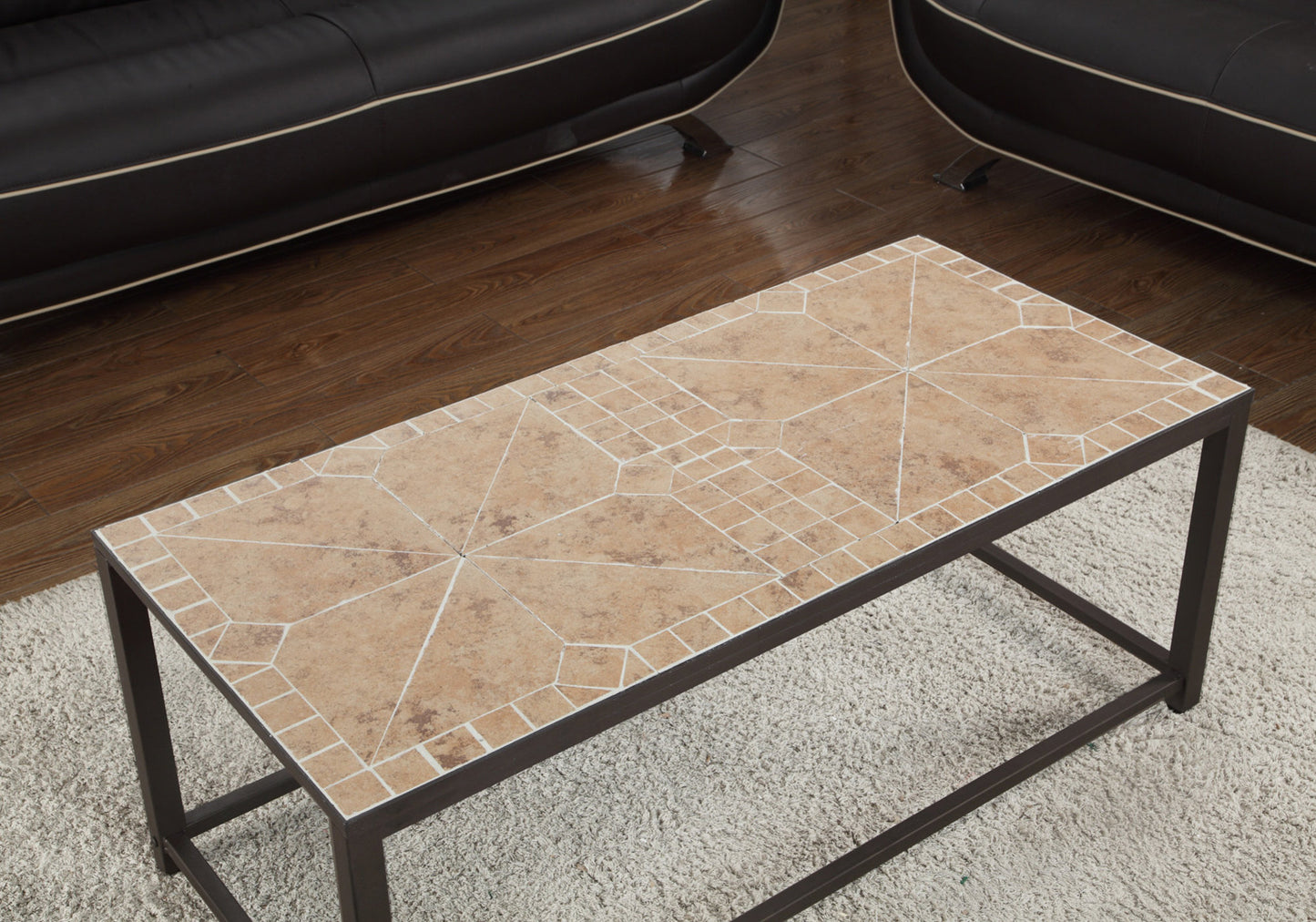 Rectangular coffee table with a terracotta tiled geometric mosaic top and dark metal frame