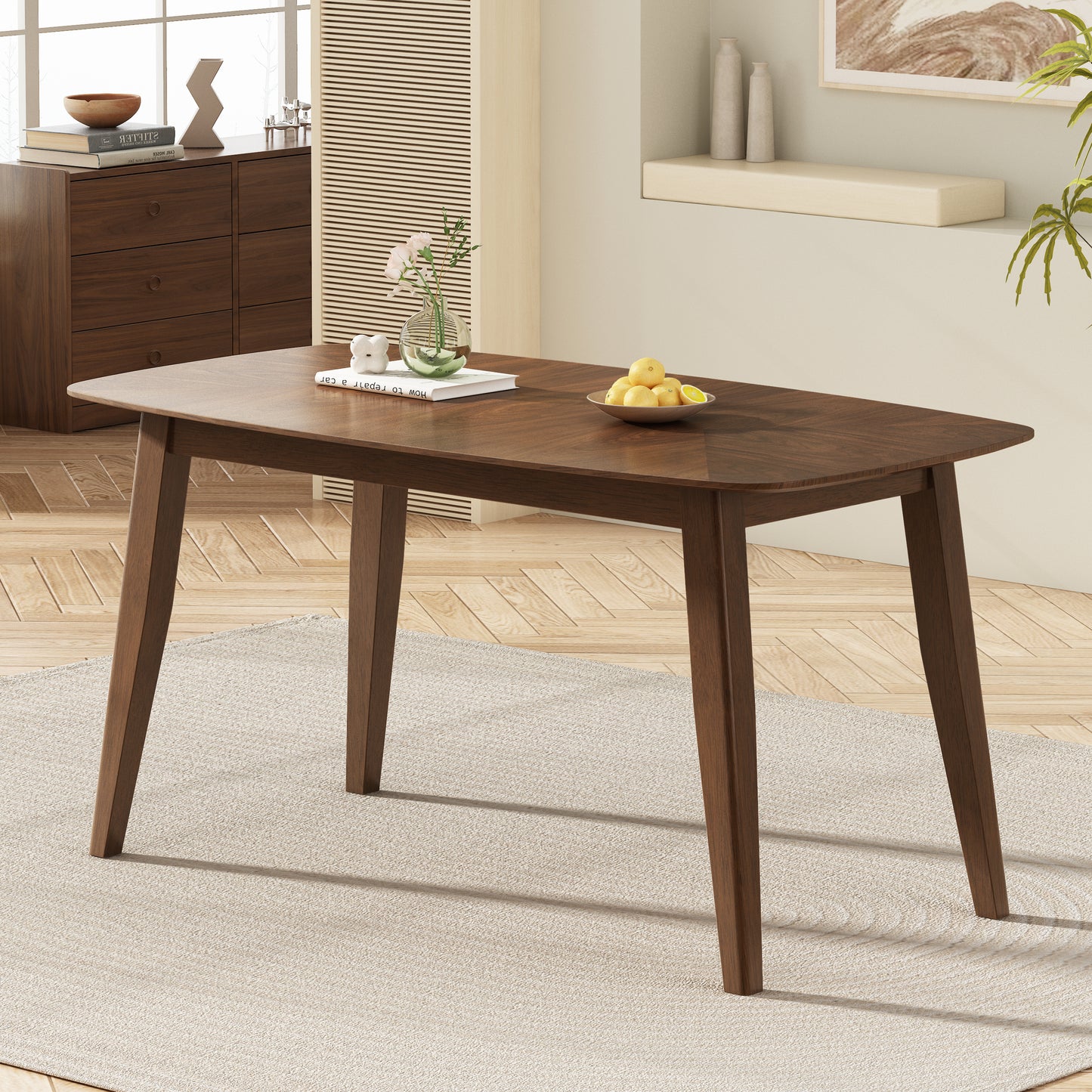 Modern walnut dining table with a herringbone wood grain top and tapered legs