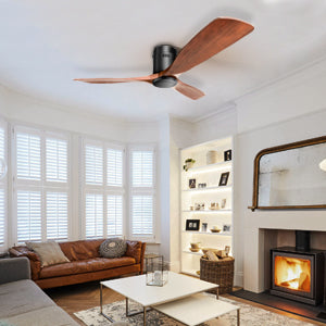 Modern black ceiling fan with three mahogany wood blades installed in a living room