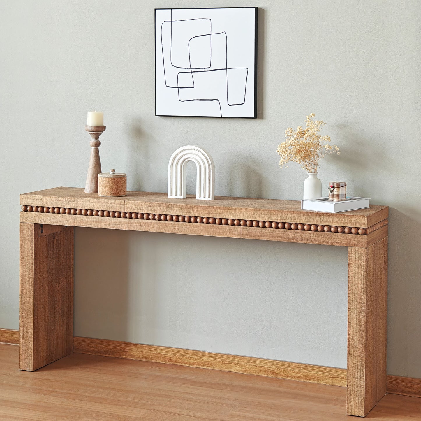 Natural wood console table with beaded trim ideal for entryway decor