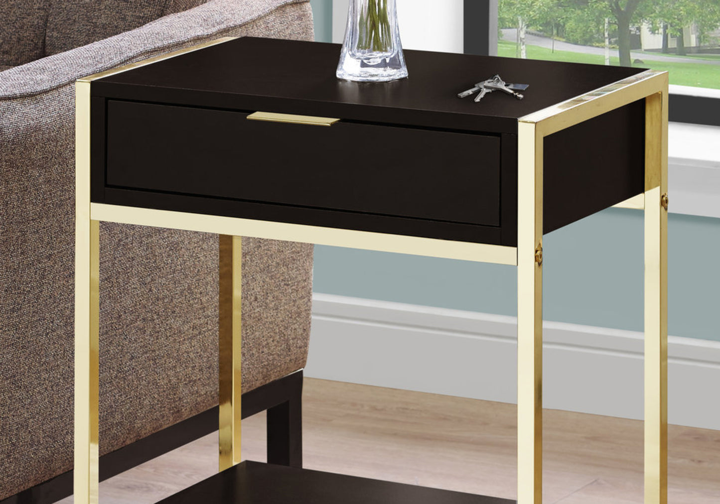 Modern black end table with polished gold frame and single drawer
