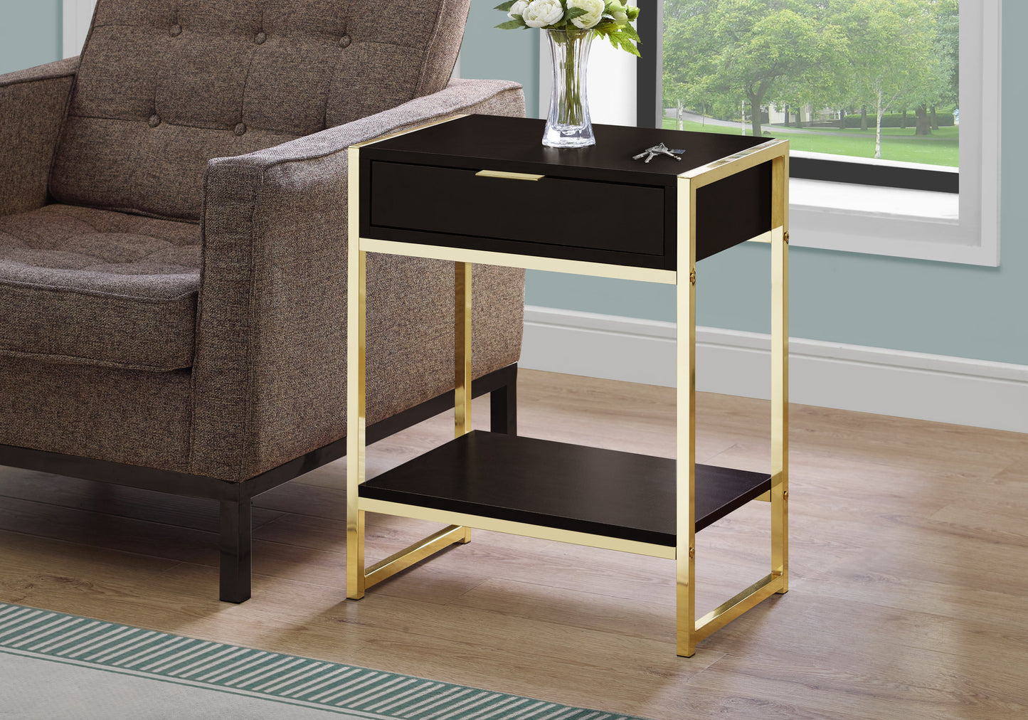 Black side table with gold frame and single drawer ideal for modern living rooms