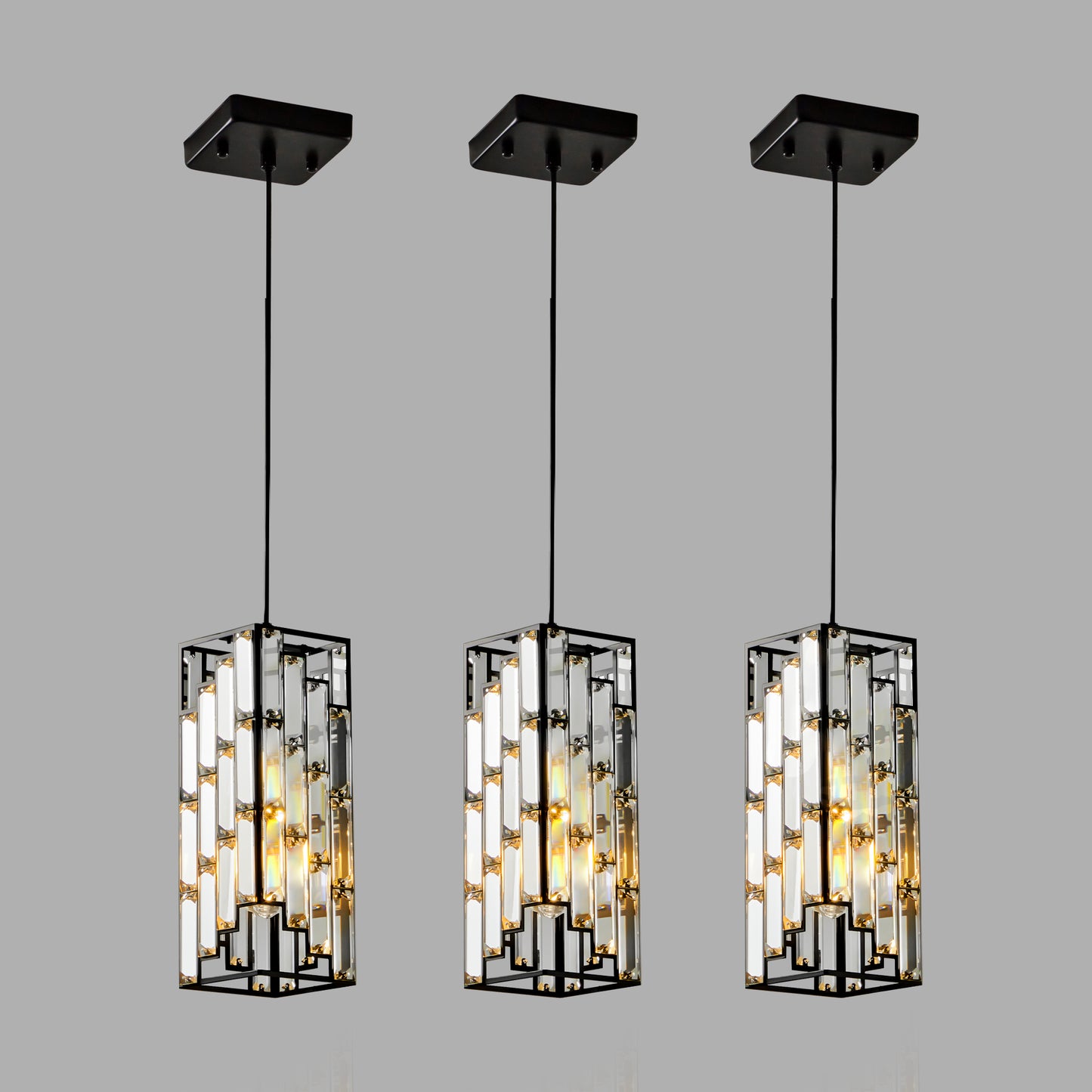 Three modern rectangular pendant lights with black frames and clear crystal accents