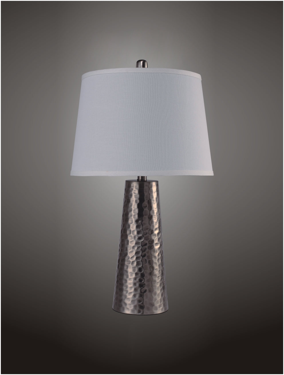 Textured metal table lamp with white drum shade and silver finial