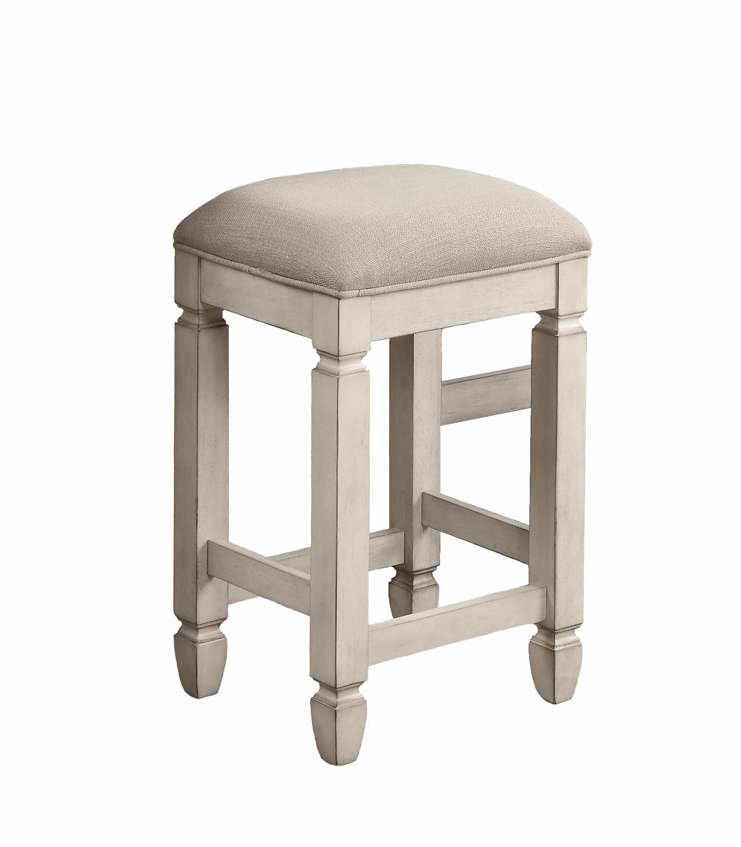 Cream upholstered square stool with distressed white wooden base and legs