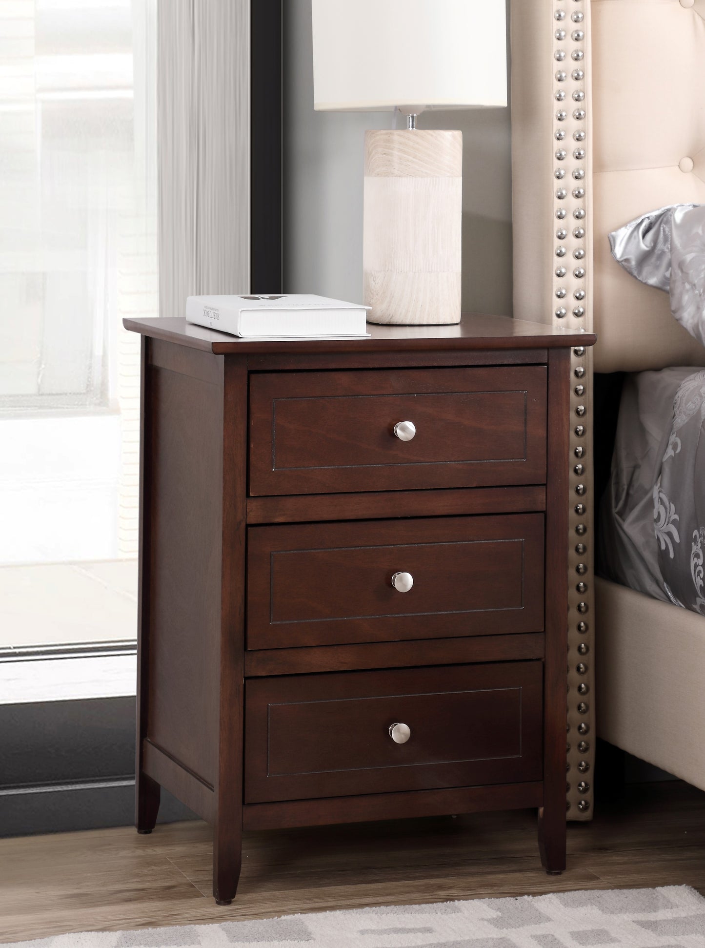Dark brown wooden nightstand with three drawers and silver knobs