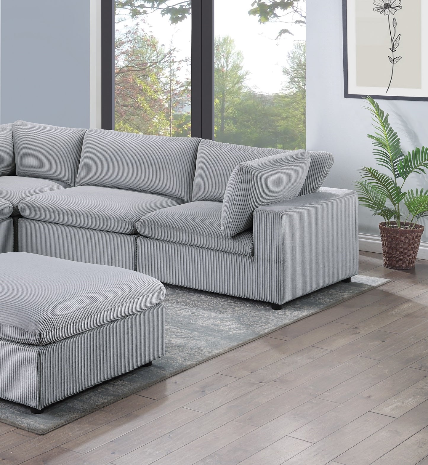 Plush grey corduroy sectional sofa with matching ottoman for ultimate comfort