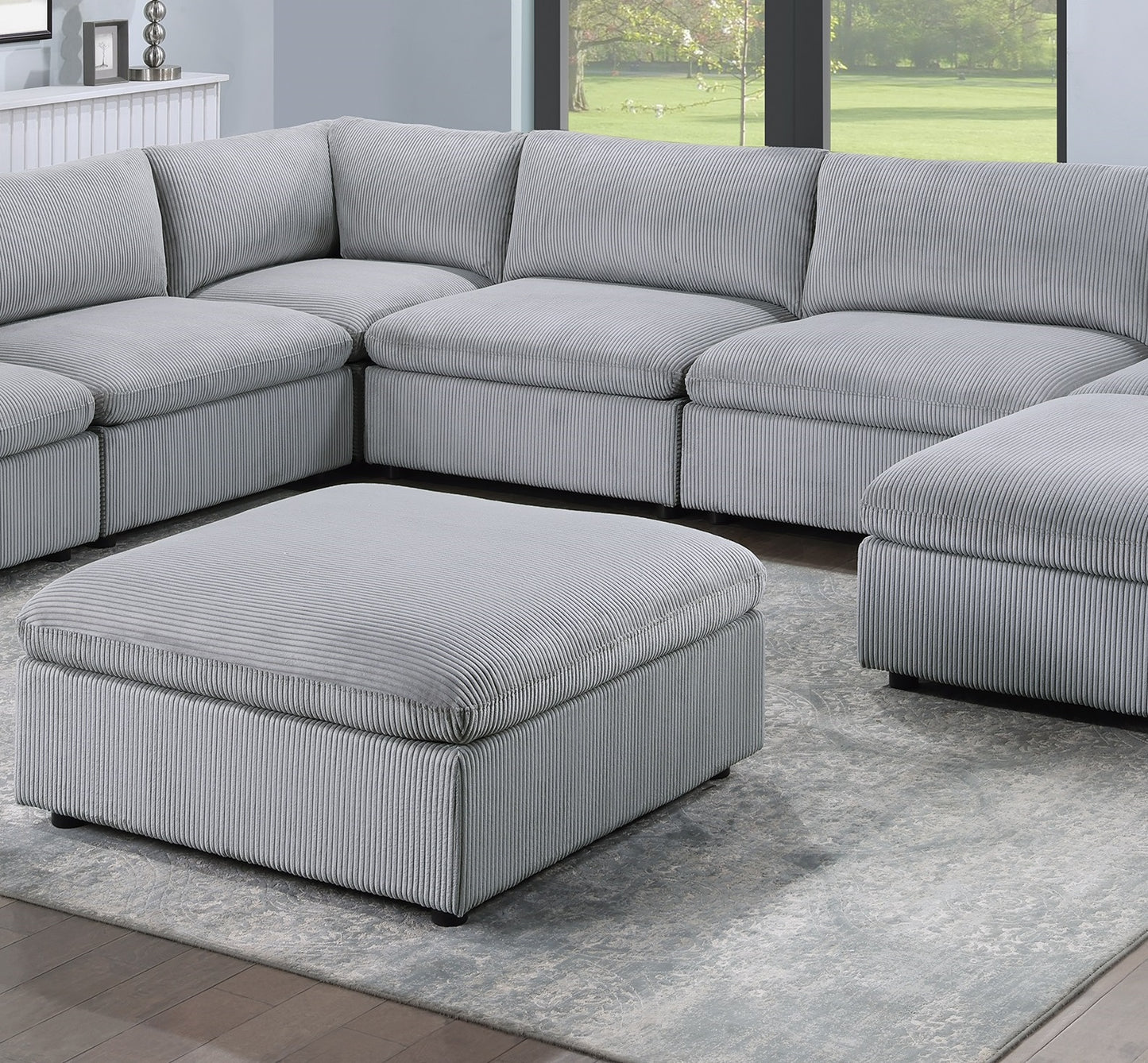 Plush corduroy modular sectional sofa in light gray with an ottoman perfect for a living room