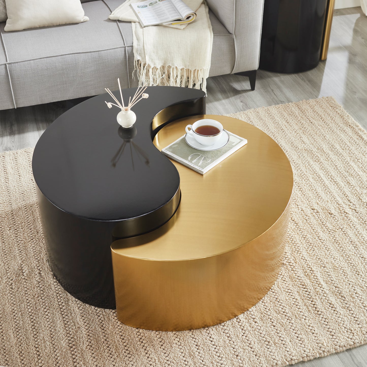 Twotiered modern coffee table with black and gold yinyang design