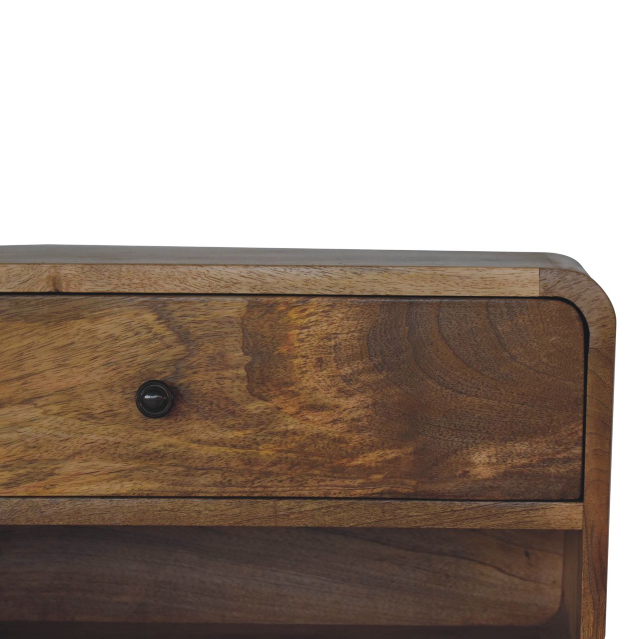 Closeup of a rustic wooden bedside table with a single black knob drawer