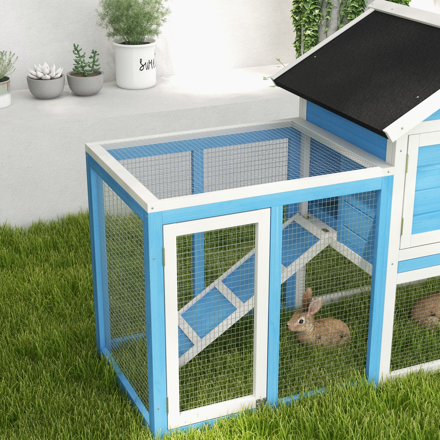 Blue and white wooden rabbit hutch with mesh doors and ramps offering ample outdoor space