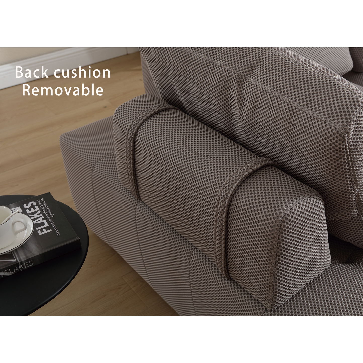 Closeup of a taupe textured fabric sofa with removable back cushion