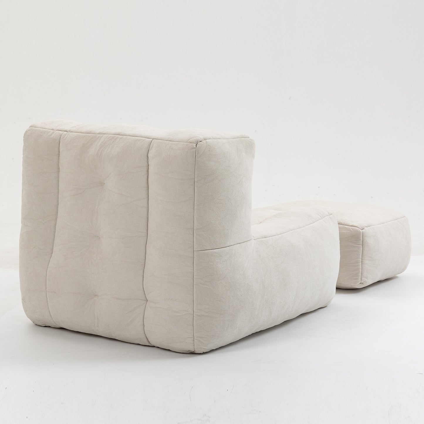 Cream boucle modular armchair with ottoman featuring deep button tufting and contemporary design for living rooms