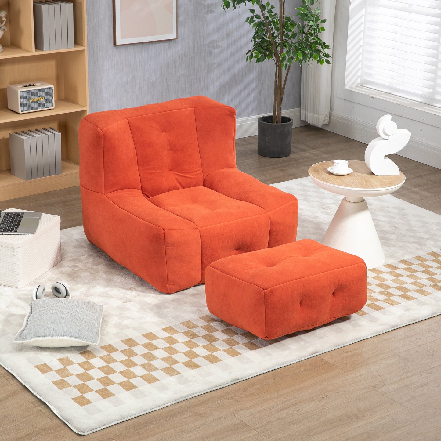 Orange modular armchair and ottoman set with button tufting on a rug