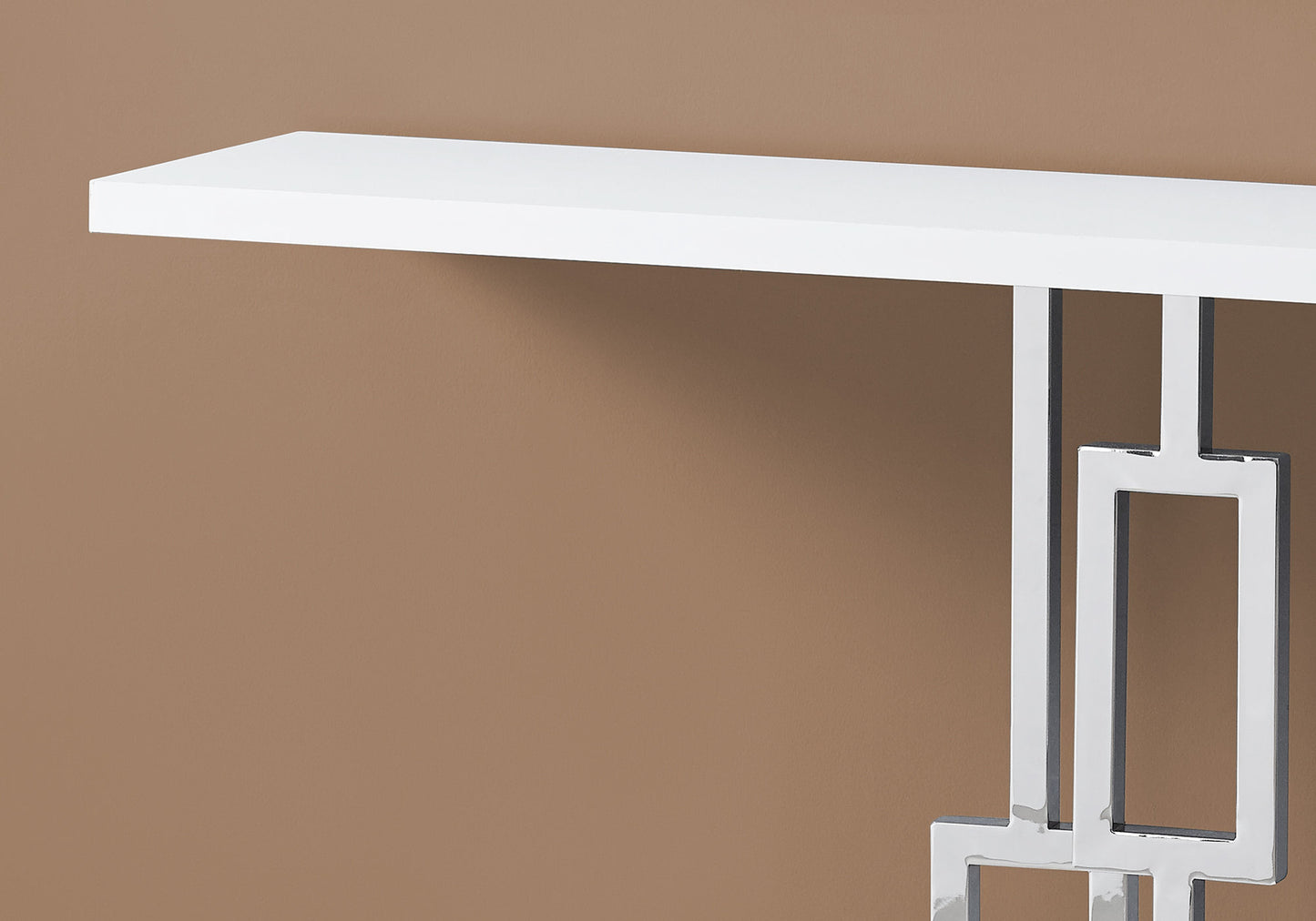 Sleek white console table with a geometric chrome base perfect for modern entryways