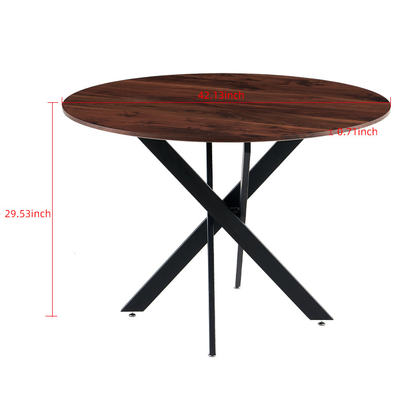 Round walnut veneer dining table with black metal spider leg base for modern kitchens