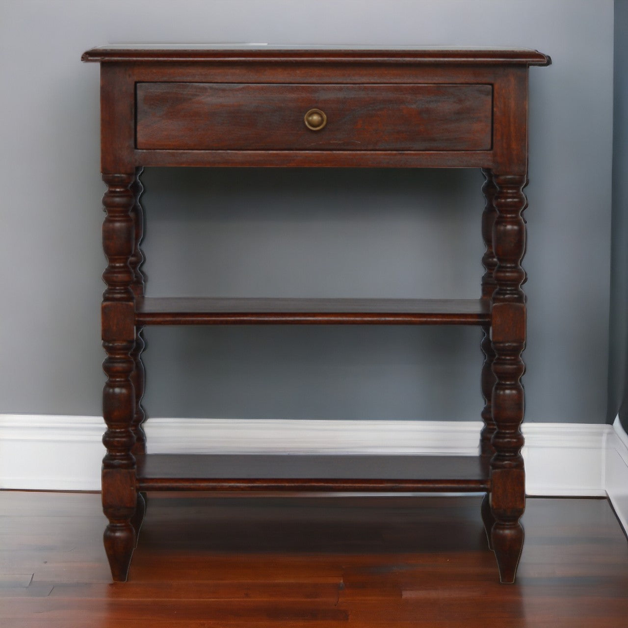 Ornate dark wood console table with one drawer and two open shelves ideal for entryways