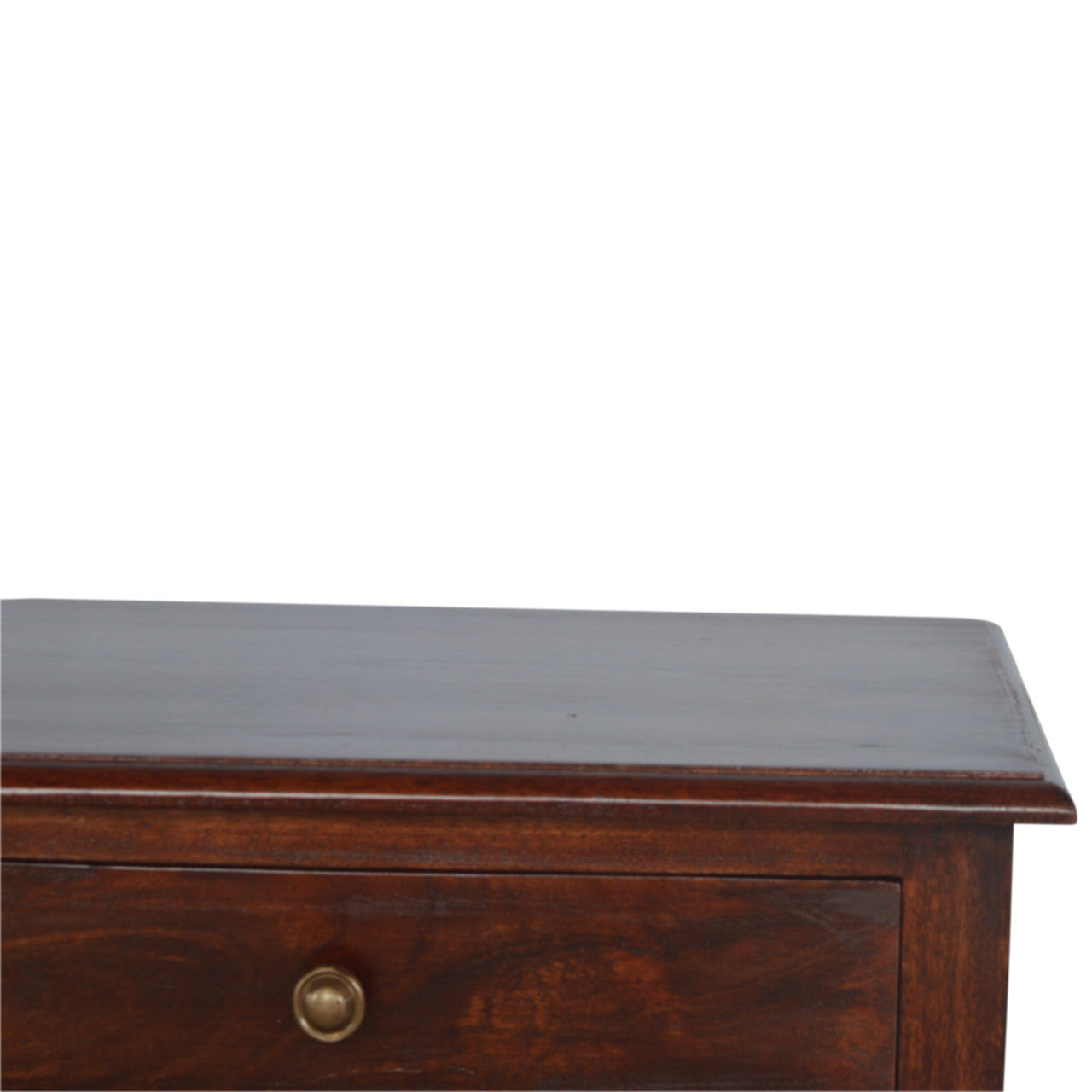 Closeup of a dark wood side table with a brass drawer pull