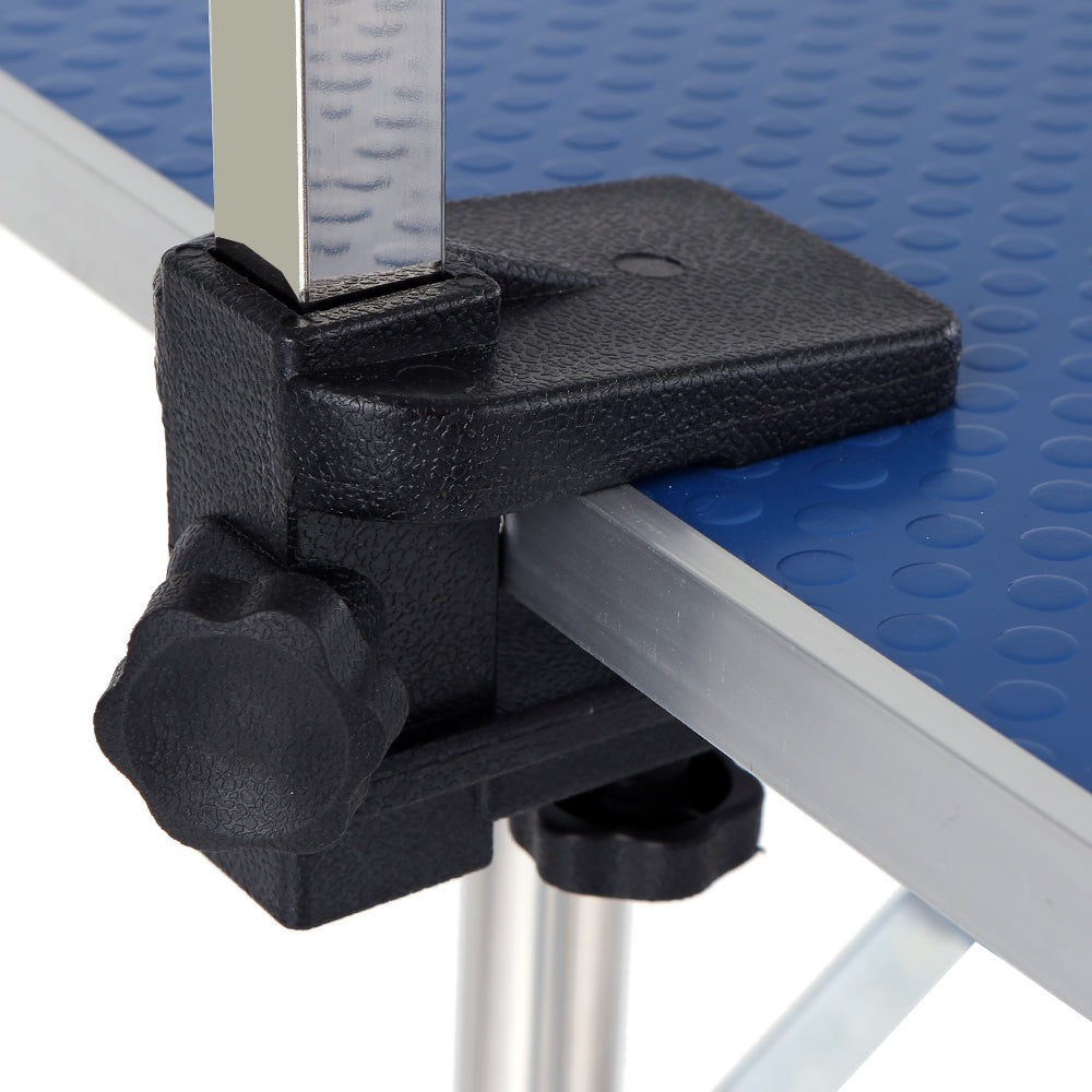 Black clamp detail on a blue textured grooming table with silver metal frame
