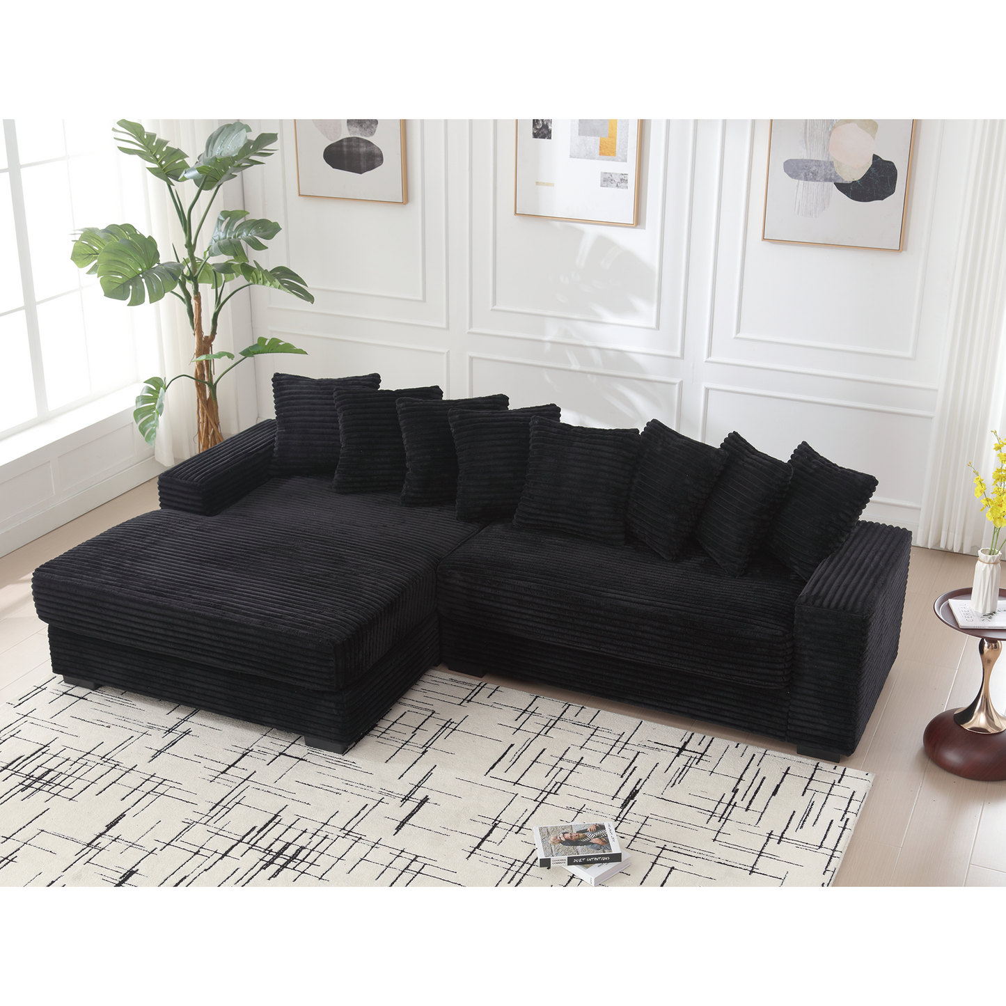 Black corduroy sectional sofa with plush accent pillows ideal for modern living rooms