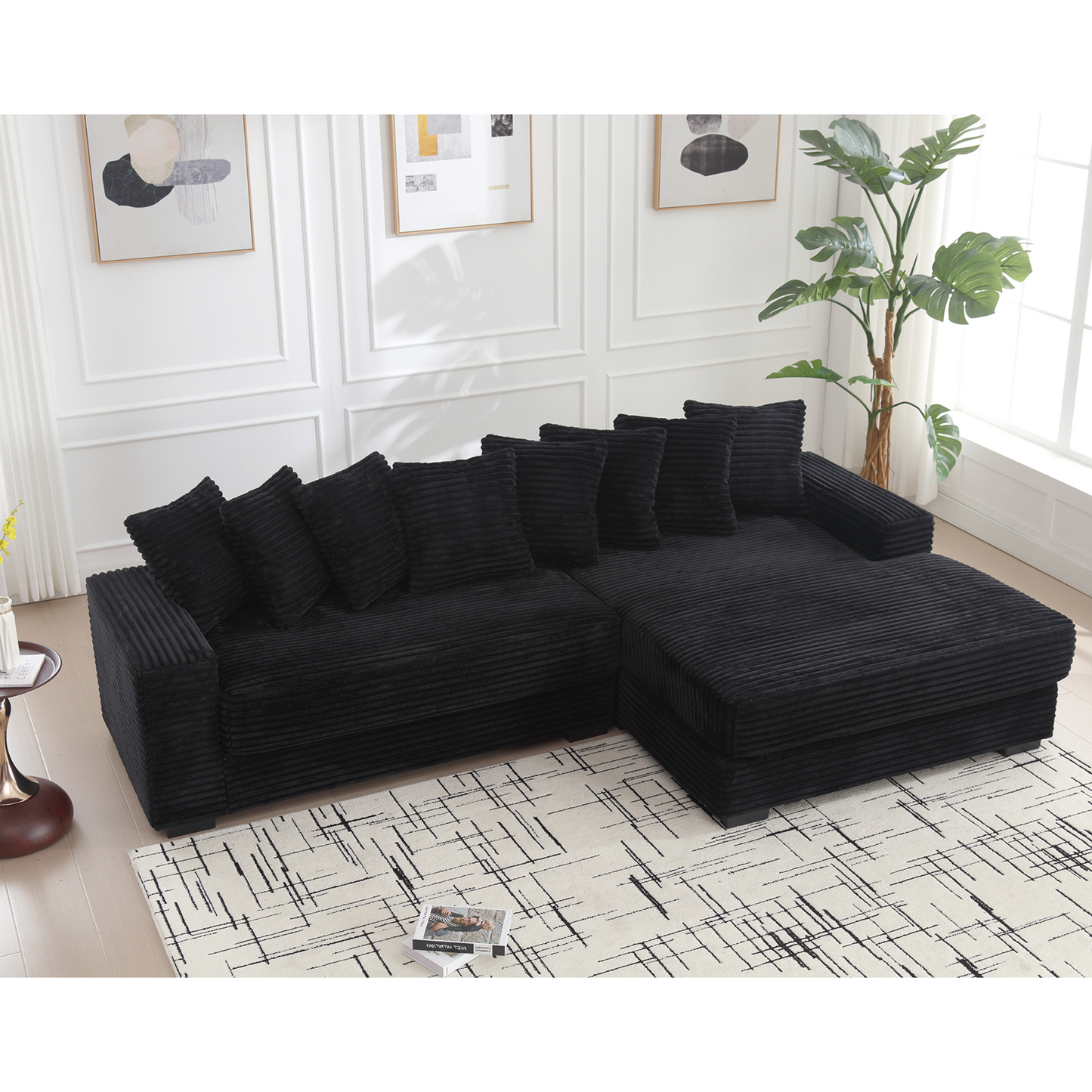 Black corduroy sectional sofa with plush cushions and chaise lounge