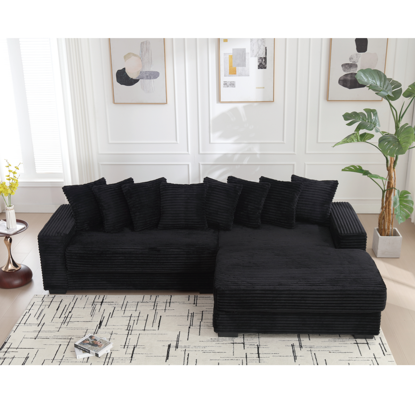Black corduroy sectional sofa with plush cushions and ottoman modern living room seating