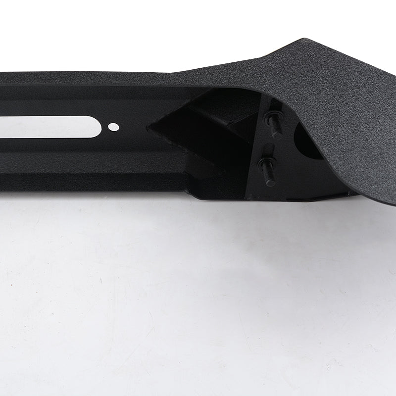 Black textured steel rock slider for offroad vehicles with mounting bolts visible