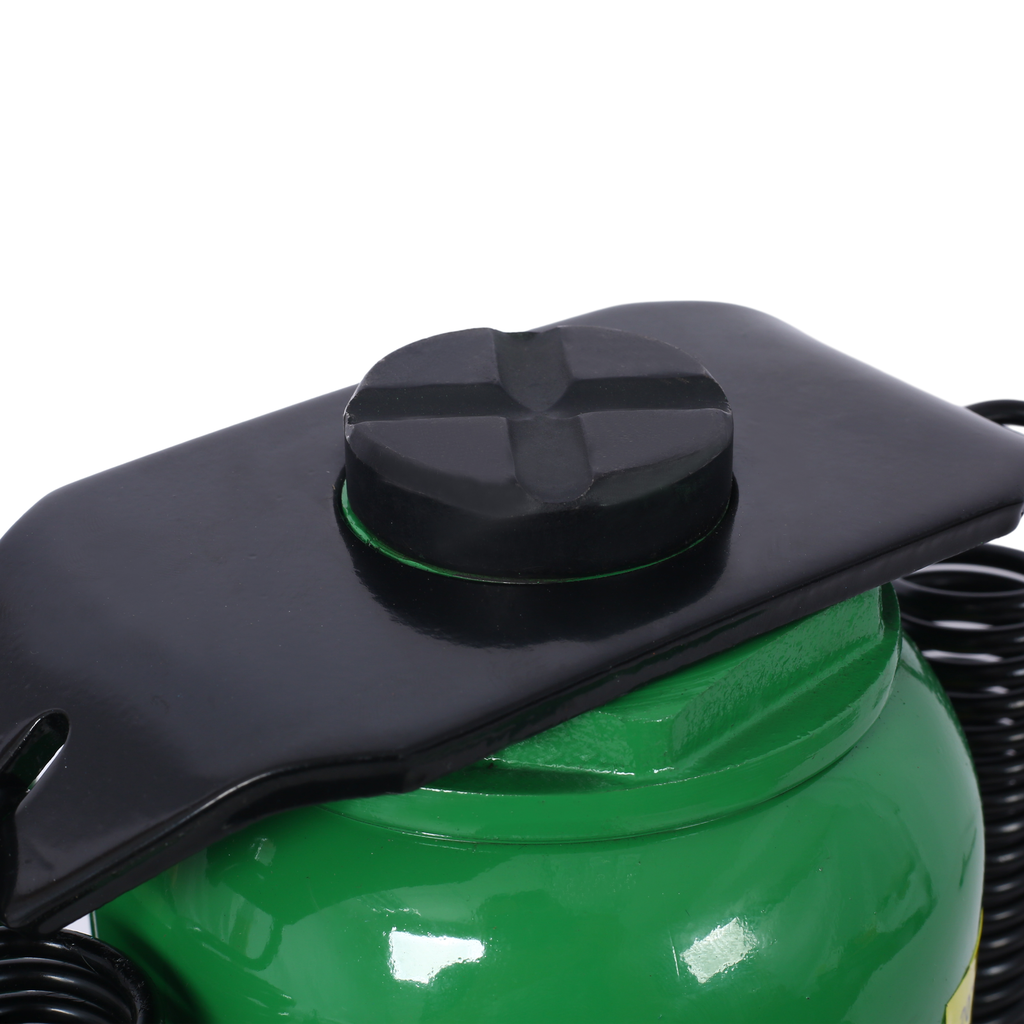 Green hydraulic bottle jack with black rubber saddle for lifting vehicles