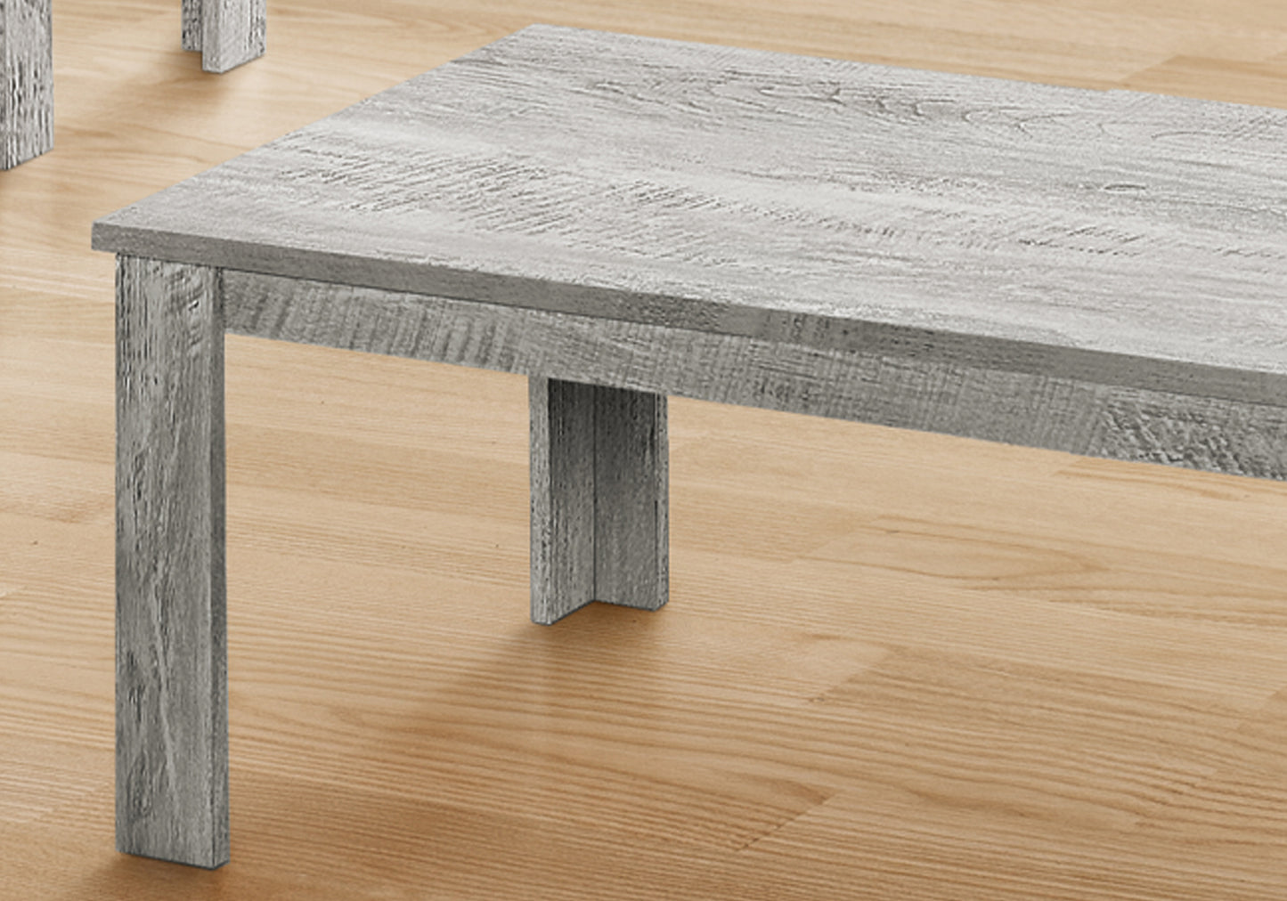 Rustic grey wood coffee table with textured finish perfect for modern living rooms