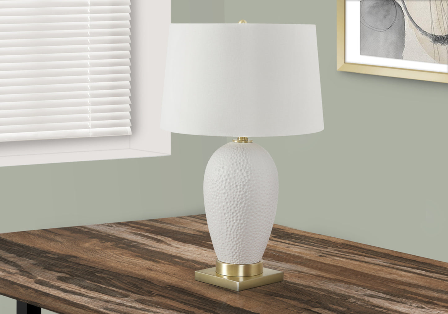 White ceramic table lamp with textured finish and gold base