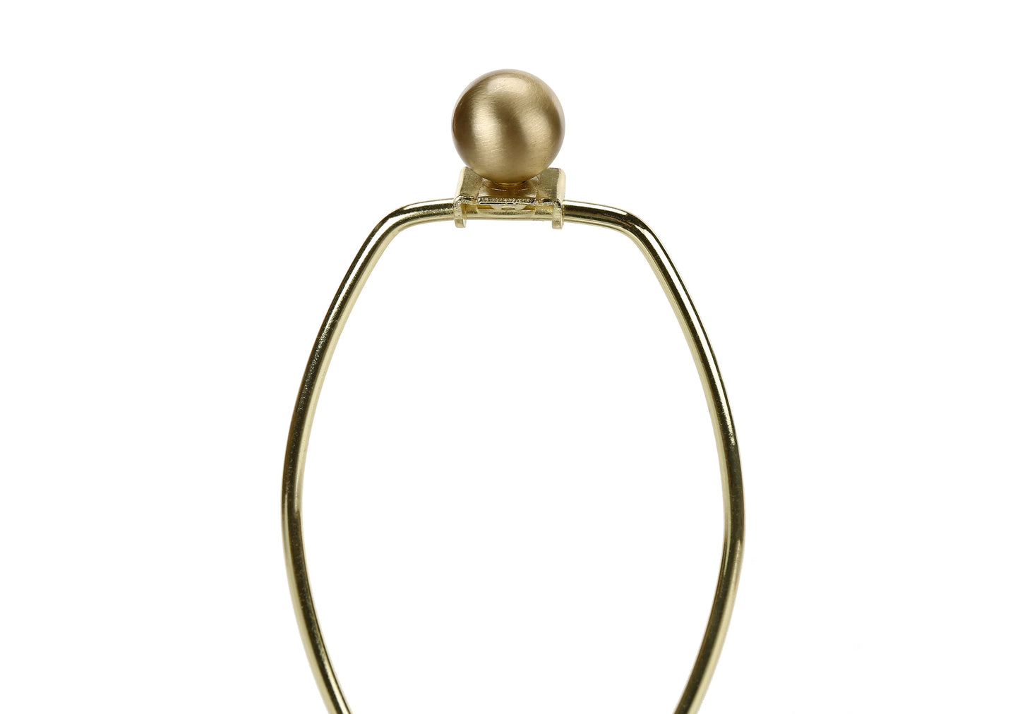 Closeup of a shiny brass harp with a spherical finial used for lamp shades