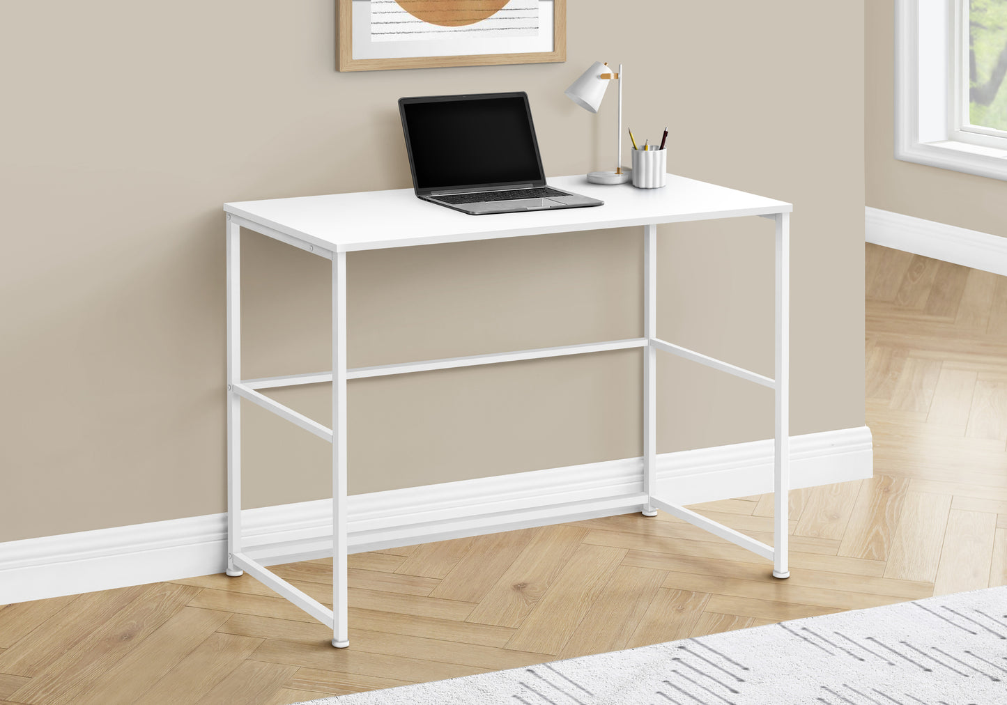 Minimalist white metal frame standing desk with a white laminate top
