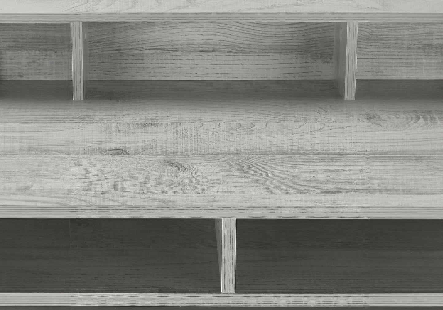 Close up of light grey wood grain shelving unit with visible divisions