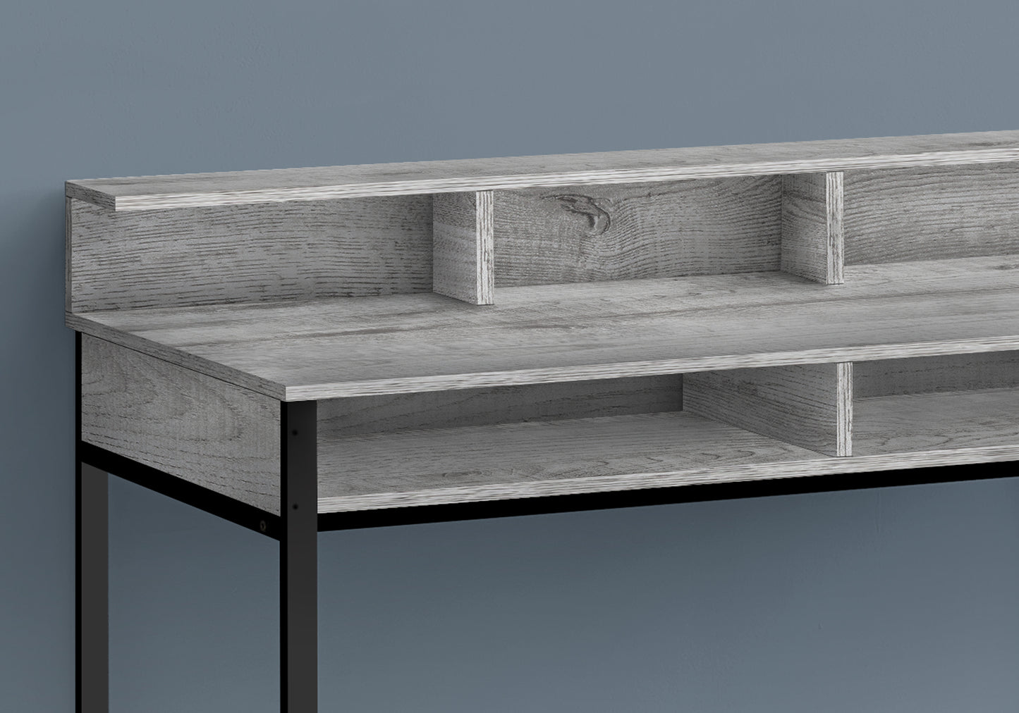 Gray wood grain desk with black metal legs and open shelving