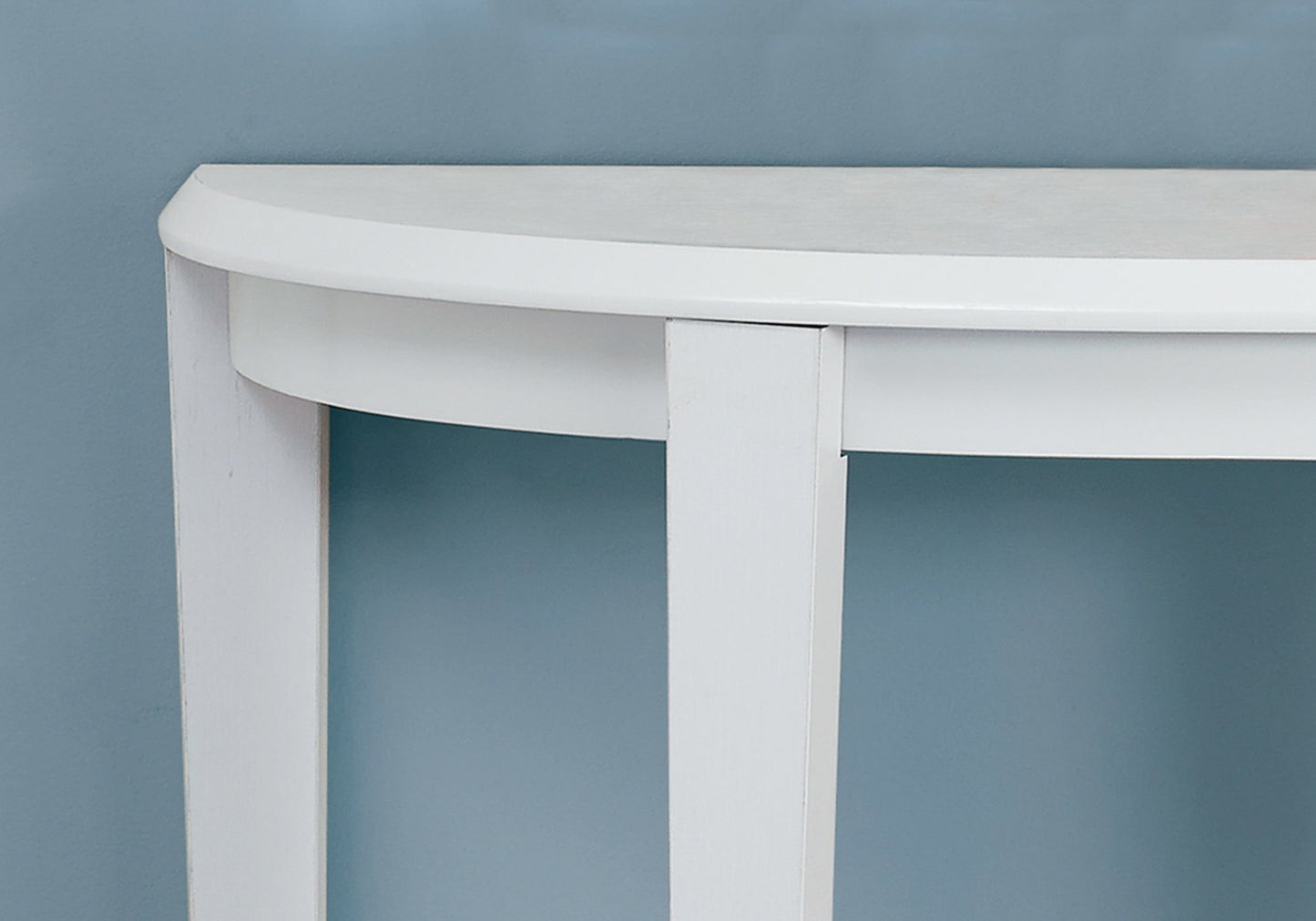 Curved white entryway table with minimalist design perfect for small spaces