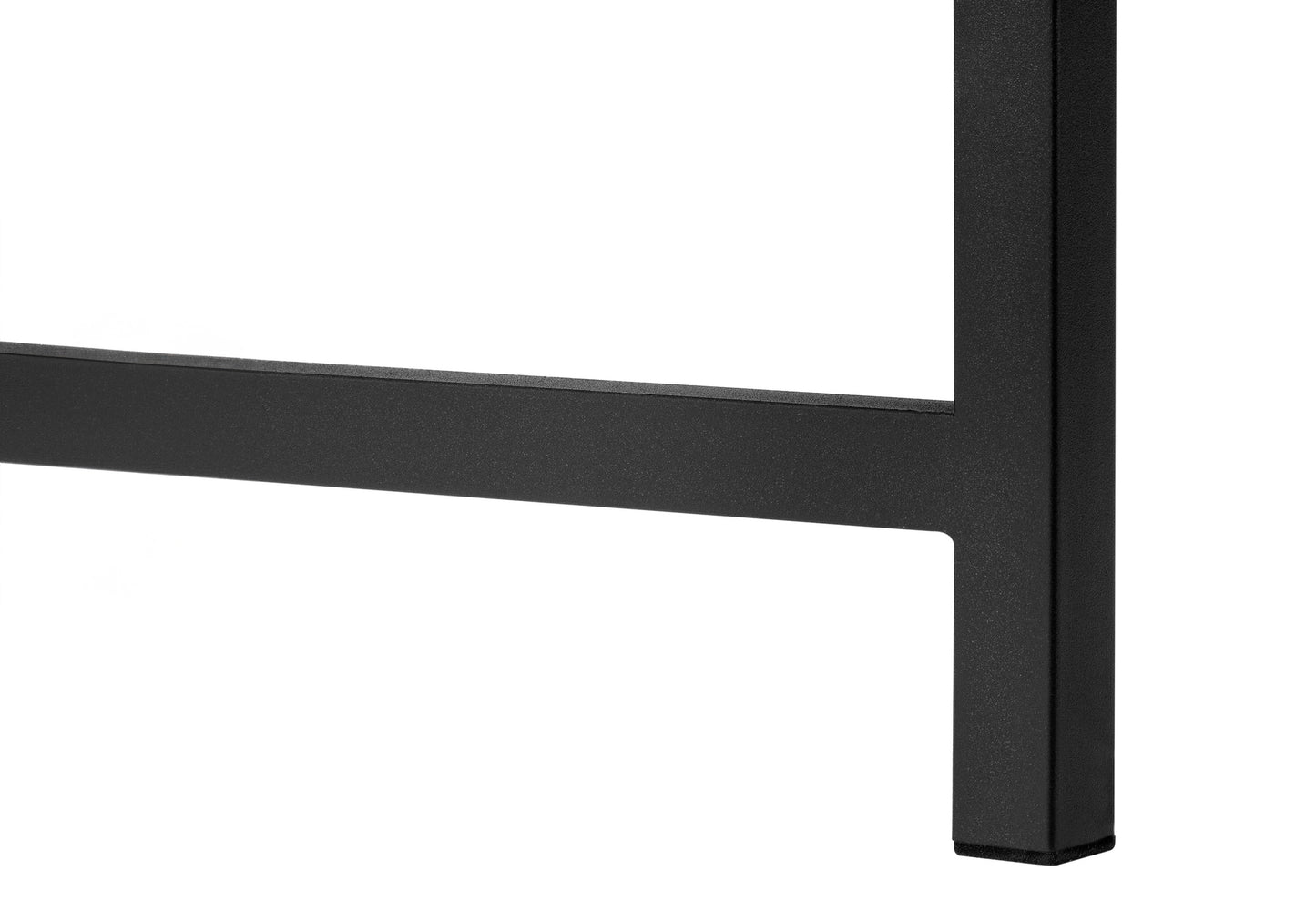 Closeup of matte black metal table leg with a textured finish